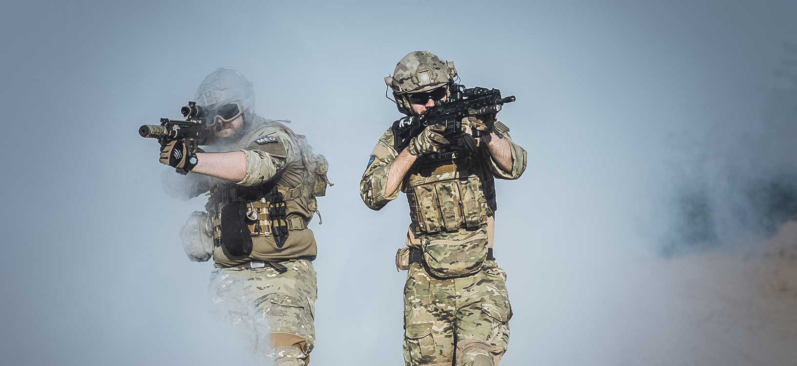 Soldiers conduct a mission on the ground. 