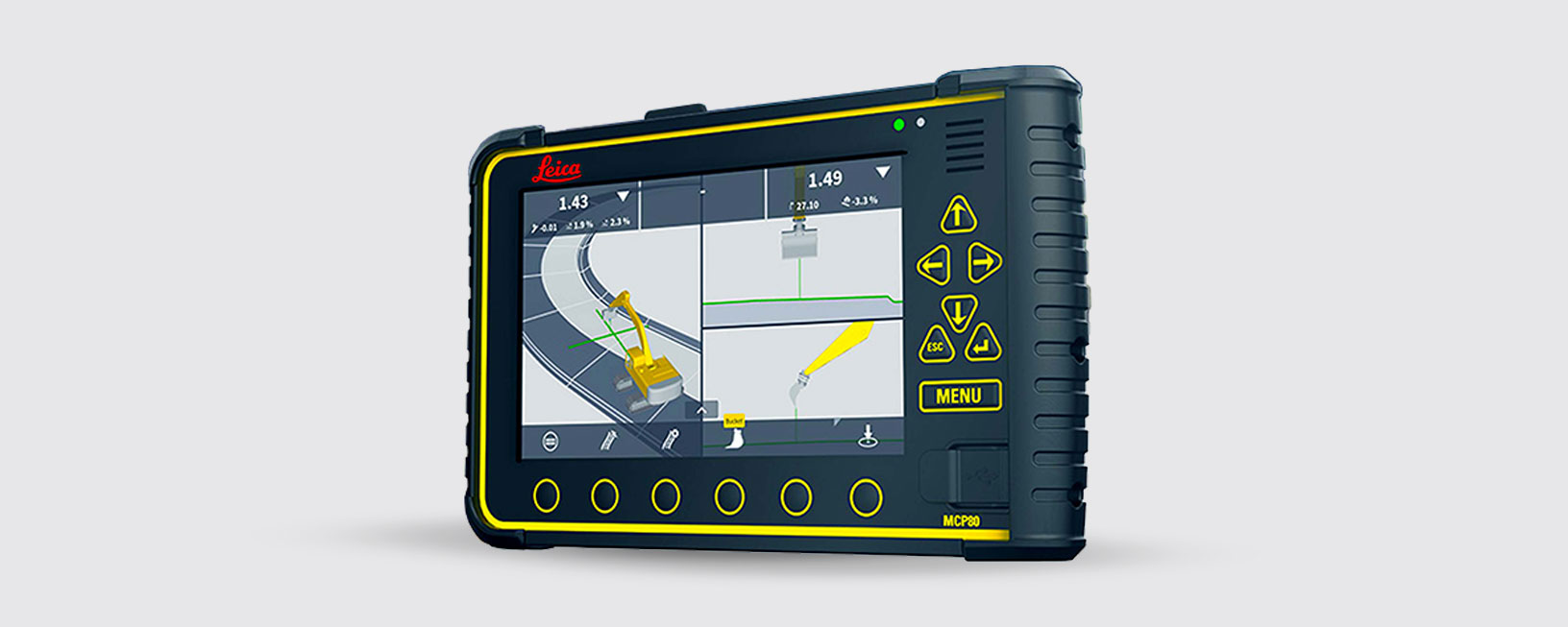 A construction site with a mcp80 panel on the foreground. MC1, machine control software can be seen on the panel.