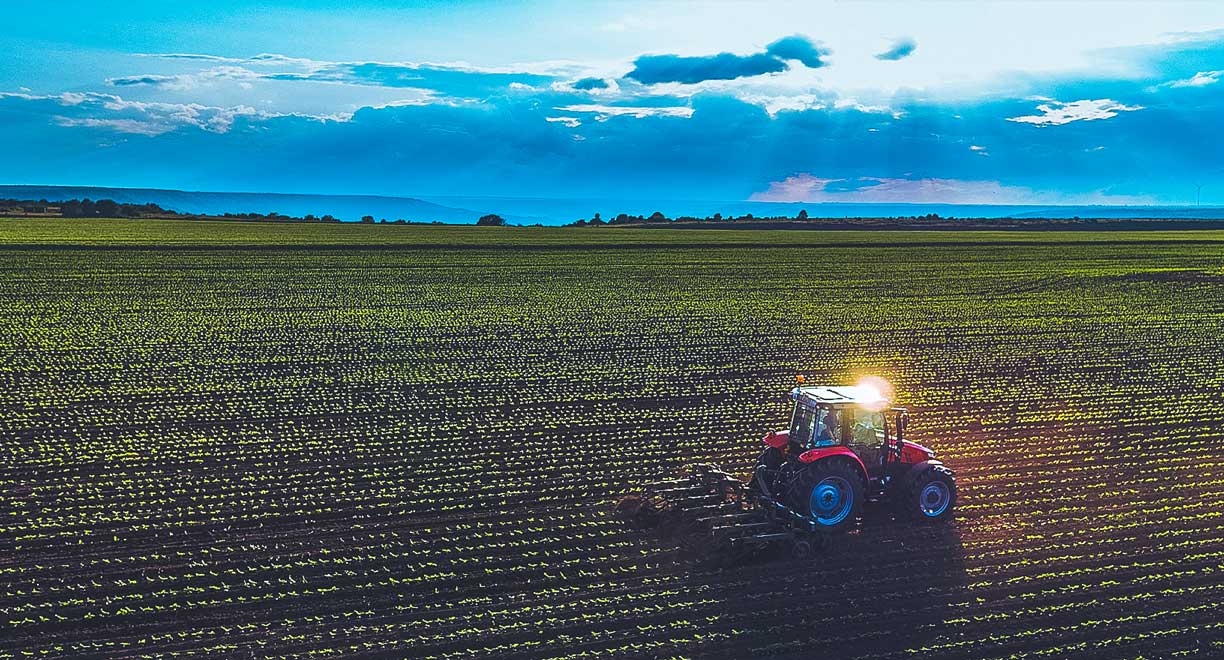 A tractor plowing a field