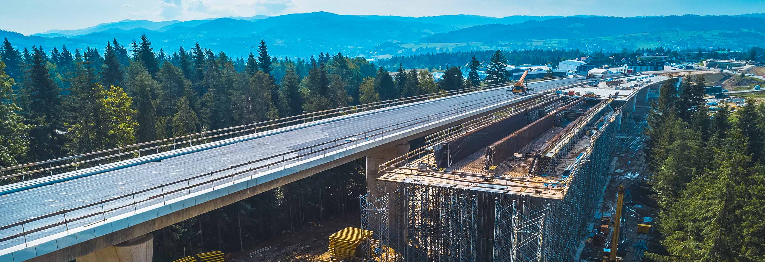 Bridge construction with mountains in background