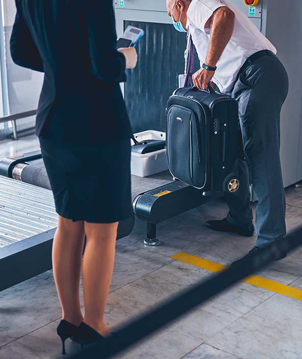 Aircraft personnel loading luggage