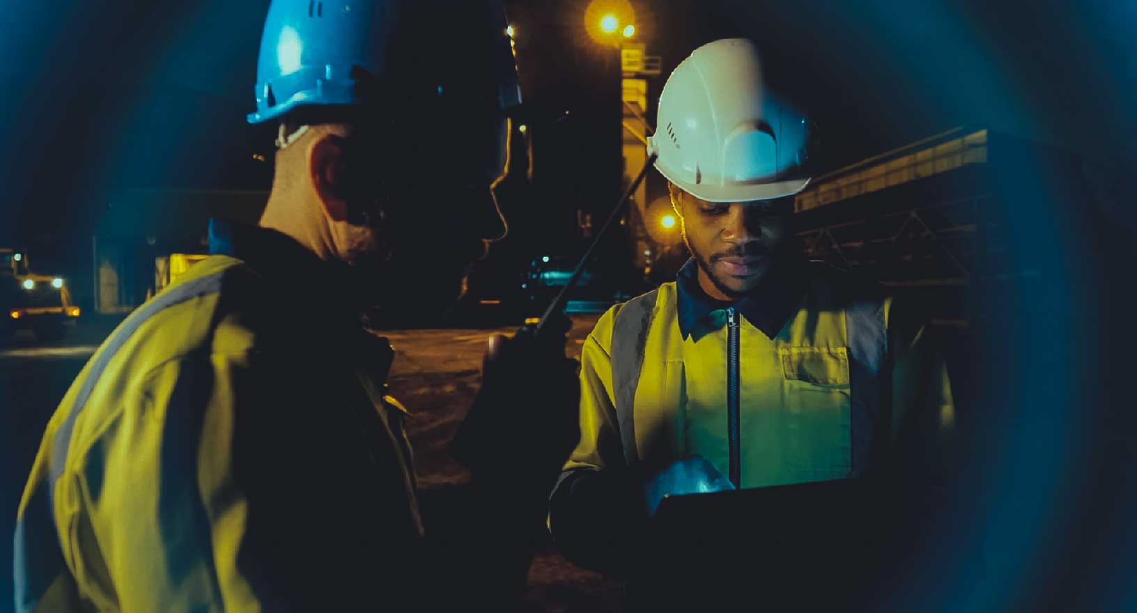 engineers inspecting and monitoring mine site with tablet